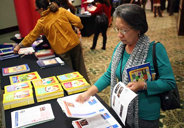 A woman peruses the CHW health education materials