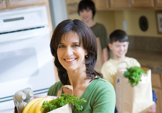 Mom and sons with groceries