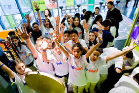 Children from Umana Middle School and their principal