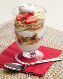 Strawberry banana yogurt parfait in a dessert glass