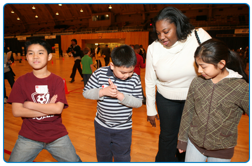 Photo of Modestine Montgomery with young students