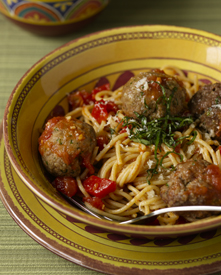 Turkey and beef meatballs with whole-wheat spaghetti in a bowl