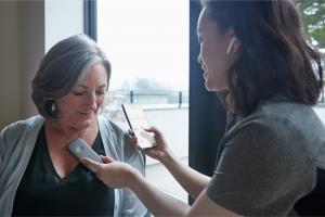 A clinician monitors a patient’s heart readings using an Eko Duo “smart” stethoscope.